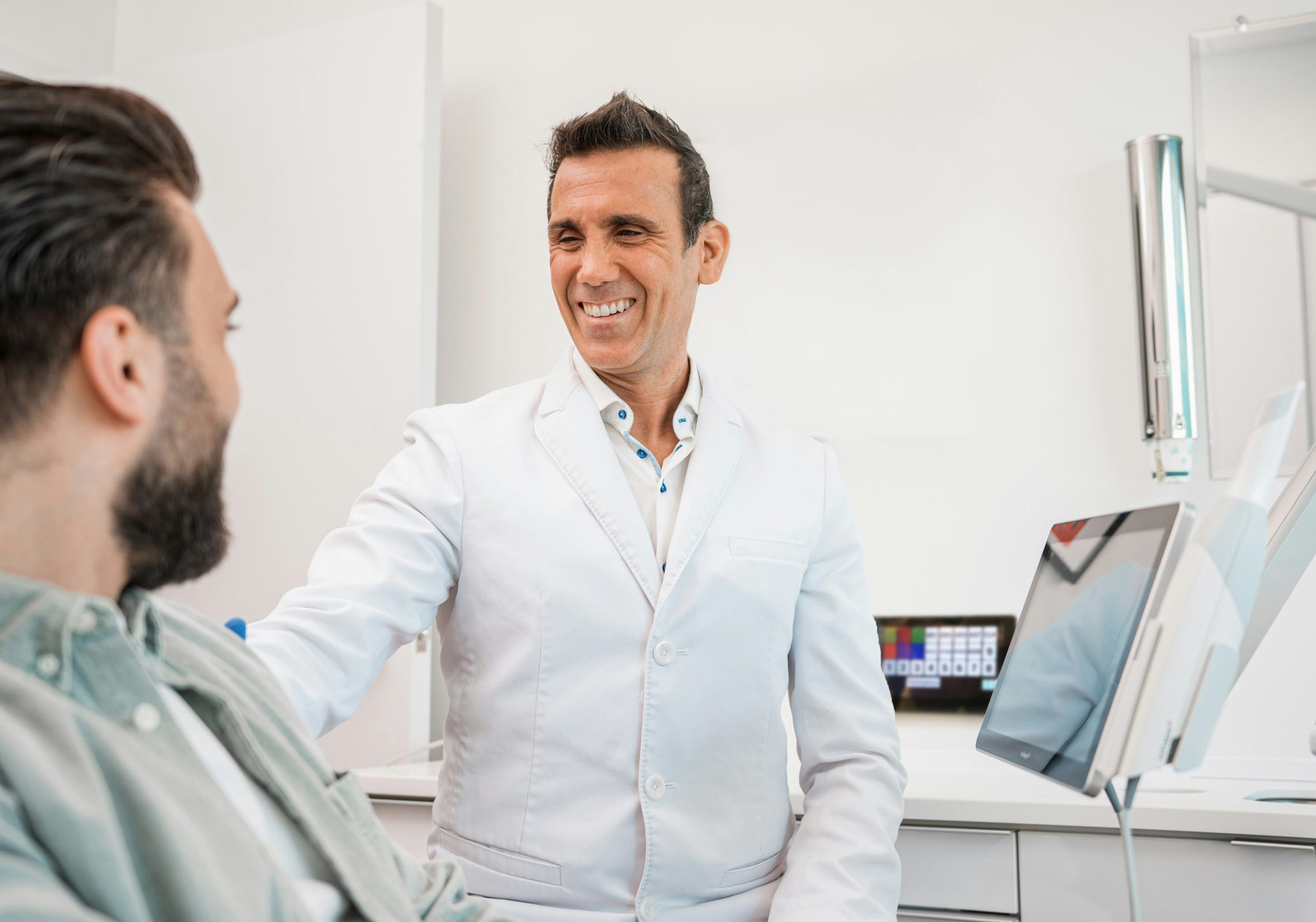 Dentist engaged with patient.